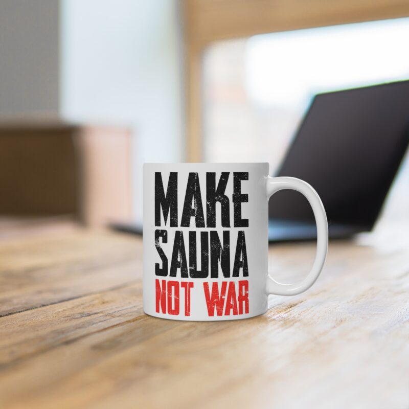 Funny coffee mug with the phrase “Make Sauna Not War” in bold peace-sign style typography