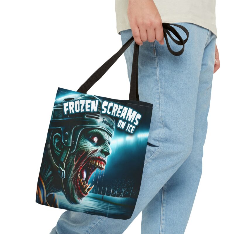 Shopping tote bag showing a spooky frozen lake scene beneath the phrase “Frozen Screams On Ice”