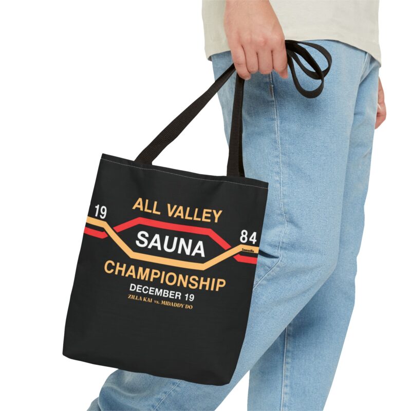 Shopping tote bag styled like an 80s tournament poster – “All Valley Sauna Championship” headline with löyly drama