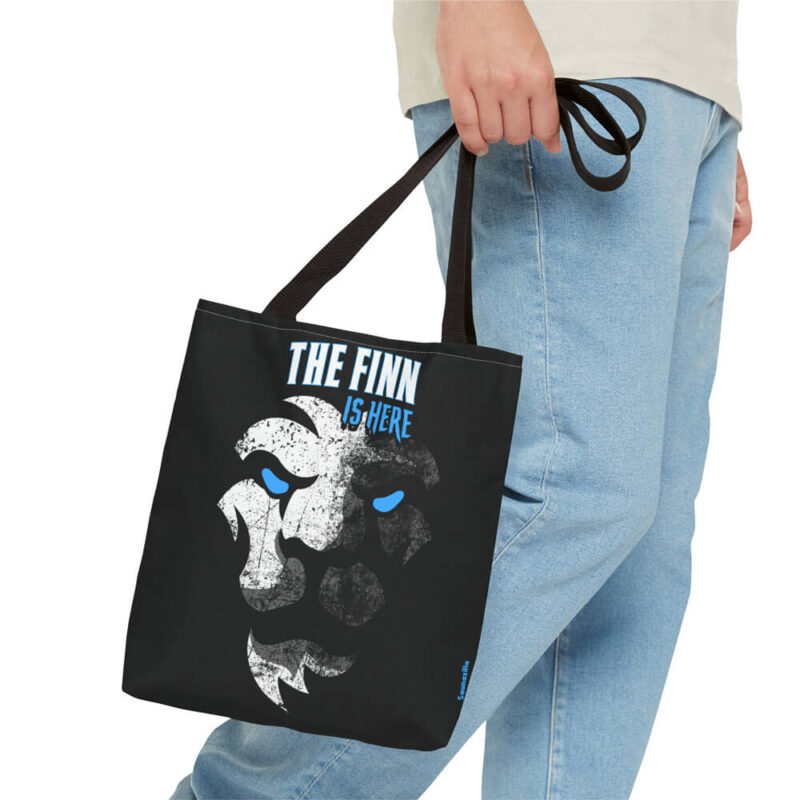 Canvas tote bag with bold “The Finn Is Here” text in a strong, minimalist design